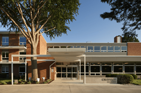 West Des Moines apartment for rent - a large brick building with a large tree in front of it