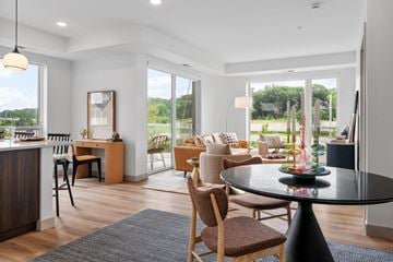 St Louis Park apartment for rent - a living room and dining room with a table and chairs