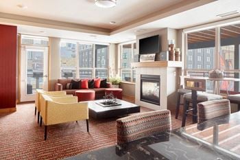 Living room with a fireplace and a television