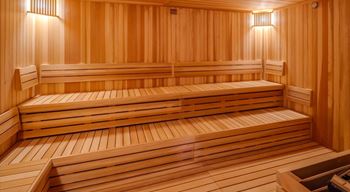 A wood sauna with two benches in it