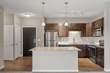 Apple Valley apartment for rent - A modern kitchen with a large island in the center.