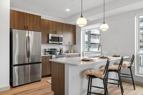 St Louis Park apartment for rent - Bright kitchen with stainless steel refrigerator at The Mera, St Louis Park, MN, Minnesota