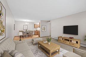 Plymouth apartment for rent - Kitchen, dining, and living rooms in a renovated apartment home at Oakwood Apartments in Plymouth, MN  55447