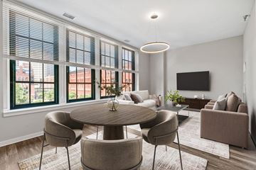St Paul apartment for rent - A modern living room with a round table and chairs.