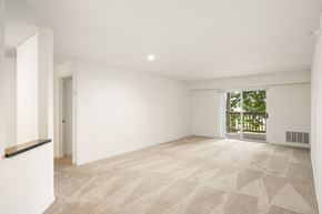 St Louis Park apartment for rent - the living room and dining room of a house with white walls and a large window at Cityscape, St Louis Park, MN