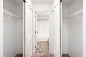St Louis Park apartment for rent - a closet in a bedroom with white doors at Cityscape, St Louis Park, MN, 55416
