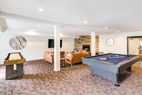 St Louis Park apartment for rent - a game room with a pool table and a tv at Cityscape, St Louis Park, 55416