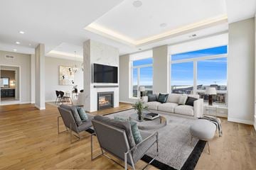 Minneapolis townhouse for rent - a living room with a couch and chairs and a fireplace