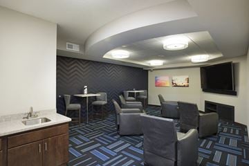 Apple Valley apartment for rent - a living room with chairs and tables and a tv