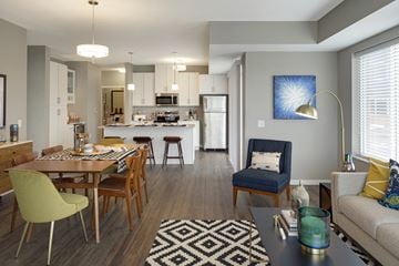 Apple Valley apartment for rent - a living room and kitchen with a dining room table and chairs