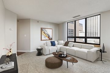 St. Paul apartment for rent - a living room with a large window and a white couch
