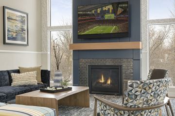 Golden Valley apartment for rent - a living room with a fireplace and a tv above it