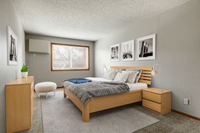 St. Louis Park apartment for rent - a bedroom with a bed and a dresser  at Park Pointe, Minnesota, 55426
