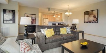 Woodbury townhouse for rent - A living room with a grey couch and a black coffee table.
