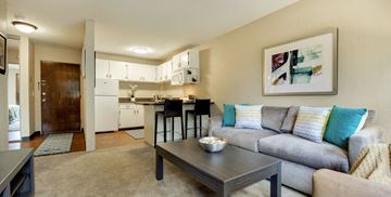 Minneapolis apartment for rent - a living room with a couch and a table