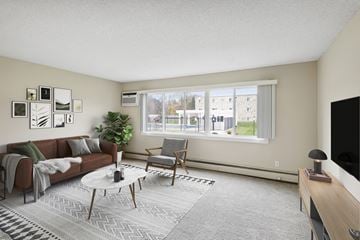 New Brighton apartment for rent - a living room with a couch and a table and a large window