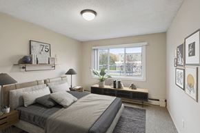 New Brighton apartment for rent - an empty bedroom with a large bed and a window at Silver Lake, New Brighton, MN, 55112