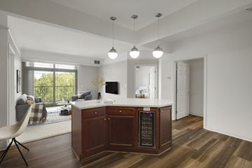 St. Louis Park apartment for rent - a kitchen with an island and a living room with a couch