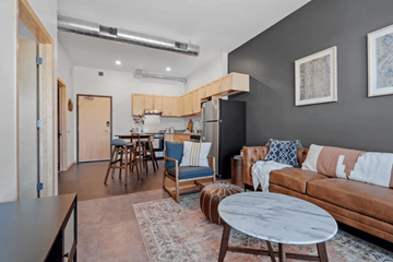 St Louis Park apartment for rent - a living room and kitchen with a couch and a table
