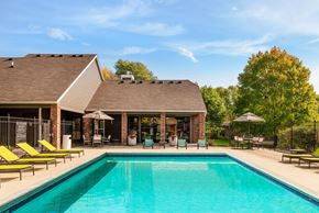 Eden Prairie apartment for rent - Outdoor pool with lounge chairs at Eden Commons in Eden Prairie, MN 55344