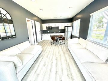 Lafayette apartment for rent - a living room with couches and a table and a kitchen
