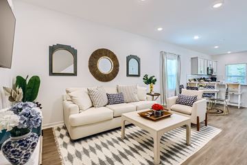 St Augustine townhouse for rent - A living room with a white sofa and a coffee table.