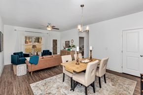 Madison triplex for rent - A dining room with a wooden table and chairs.