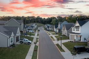 Chattanooga townhouse for rent - A residential street with houses on both sides and cars parked on the right.
