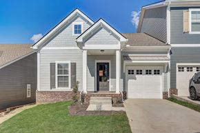 Franklin townhouse for rent - A house with a grey exterior and a white garage door.