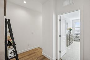 Las Vegas townhouse for rent - A white hallway with a doorway leading to a living room.