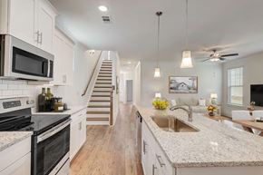 Franklin townhouse for rent - A kitchen with a stove top oven and a microwave.