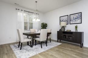 Fountain Inn townhouse for rent - a dining room with a table and chairs
