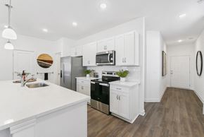 Douglasville townhouse for rent - Pristine kitchen with sleek cabinetry and open layout