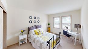 Brookfield apartment for rent - two windows in a bedroom with a bed and desk