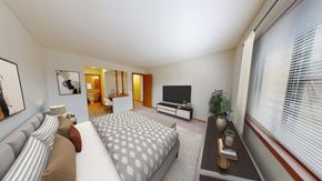 New Berlin apartment for rent - a bedroom with a bed and a large window