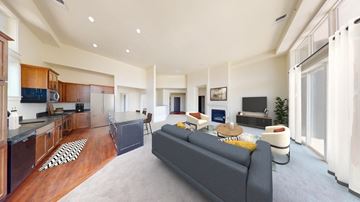 Brookfield apartment for rent - a living room with a couch and a kitchen with a table