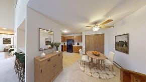 Greenfield apartment for rent - A dining room with a wooden table and chairs.