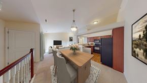 Greenfield apartment for rent - A dining room with a wooden table and chairs.