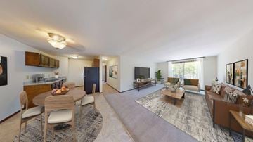 West Allis apartment for rent - A spacious living room with a dining table and chairs.