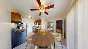 New Berlin townhouse for rent - A modern kitchen with a wooden table and chairs.