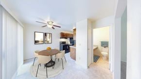 New Berlin townhouse for rent - A dining room with a round table and chairs.