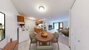 New Berlin apartment for rent - A modern kitchen with a dining table and chairs.