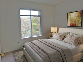Greendale apartment for rent - a bedroom with a large bed and a window