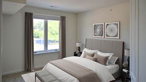 Hales Corners apartment for rent - a bedroom with a large bed and a window