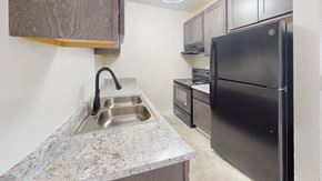 Greendale apartment for rent - a kitchen with a sink and a refrigerator