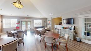 Oak Creek apartment for rent - a dining room with tables and chairs and a television