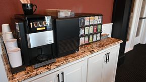 Brookfield apartment for rent - a coffee machine on a kitchen counter with a counter top full of coffee and coffee