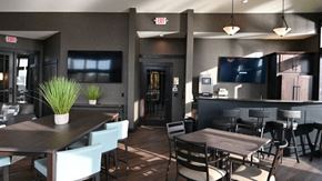 Menomonee Falls apartment for rent - a dining room with a table and chairs and a kitchen