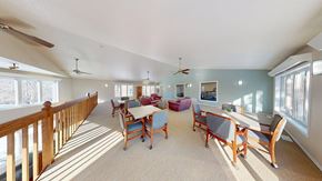 New Berlin apartment for rent - A sunny day in a spacious room with a long table and chairs.