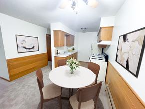 West Allis apartment for rent - a dining room and kitchen with a table and chairs